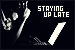 Small button featuring a black and white silhouette and the words staying up late in black and white